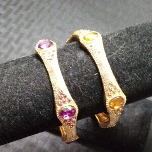 Bracelets,(2)BangleGold tone, 1 w/purple stones,1 w/gold stones, Gold tone, new.
